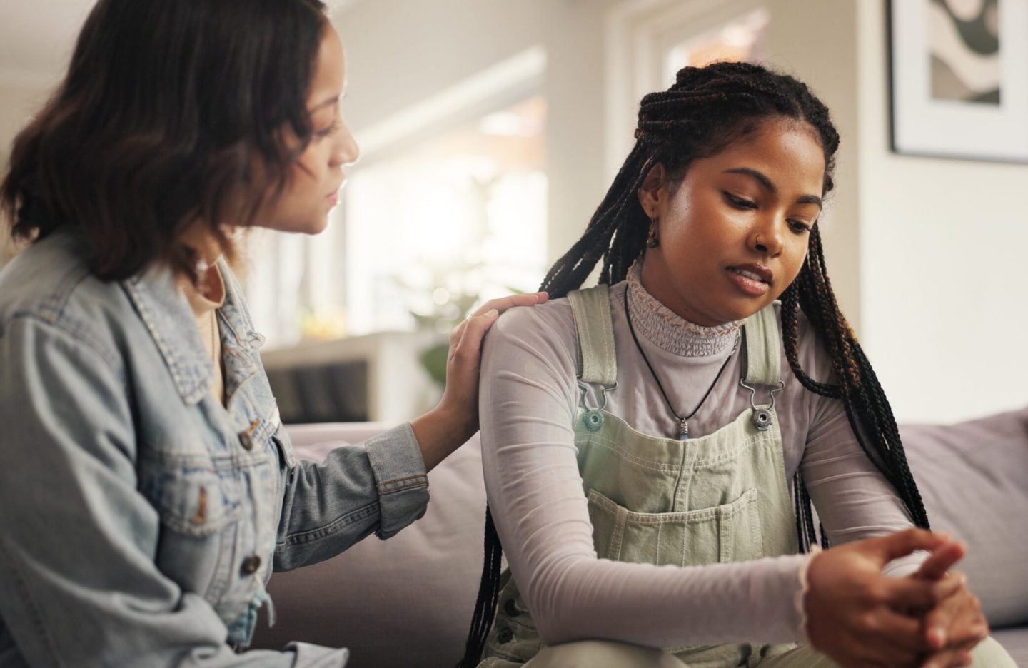 Sad, woman and friends on couch for empathy with breakup and relationship fail in home. Comfort, people and support for cheating mistake, console and kindness for mental health advice in living room.